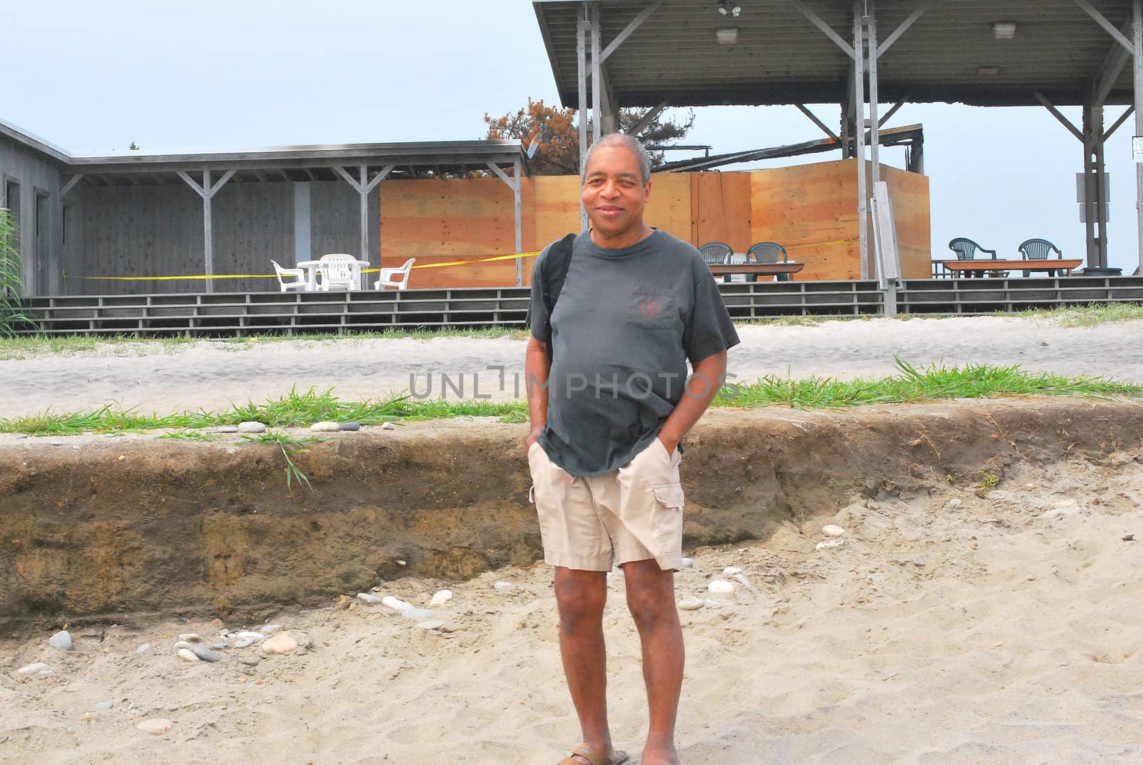 African American male standing on the beach.