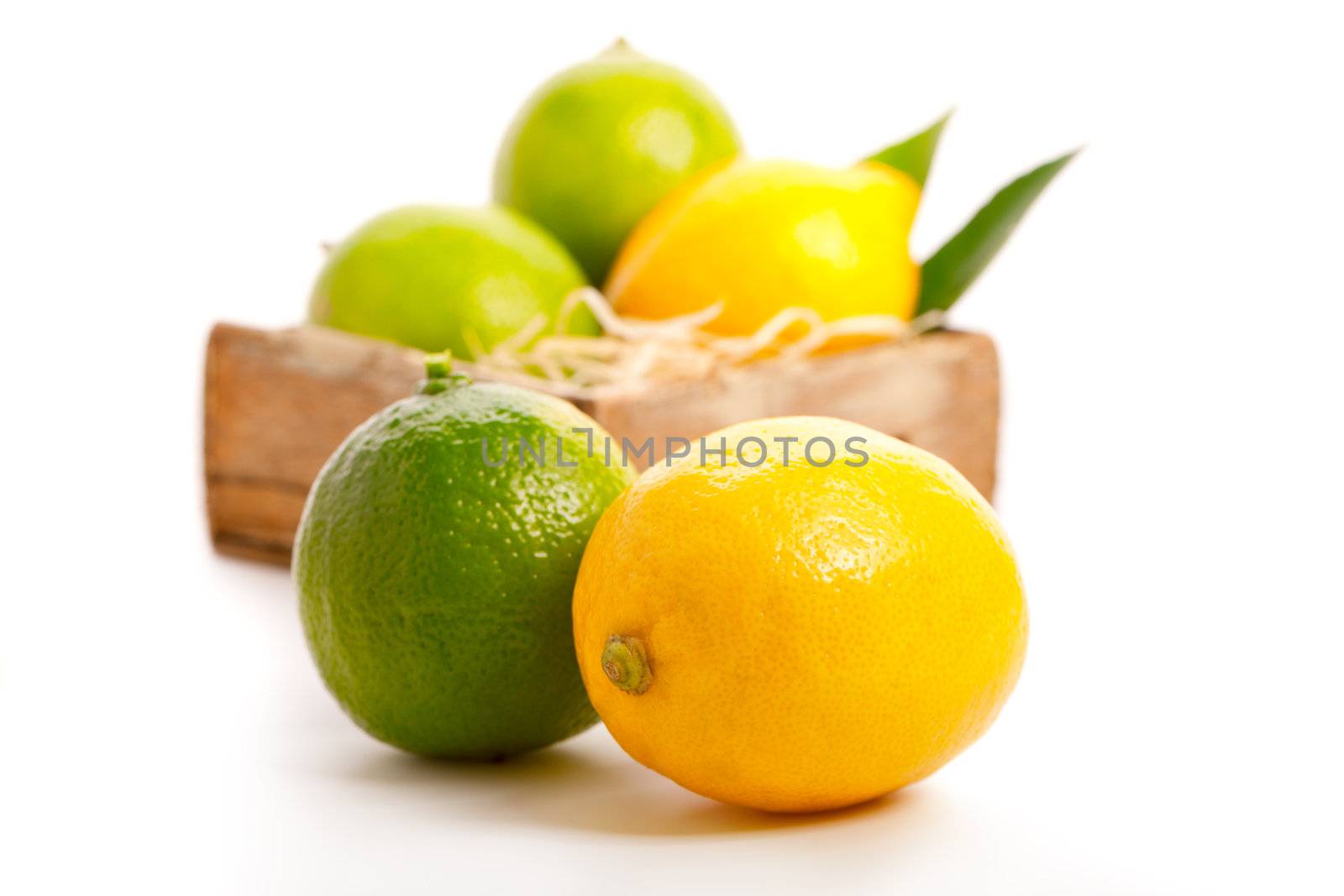 yellow and green lemon over white background. by motorolka