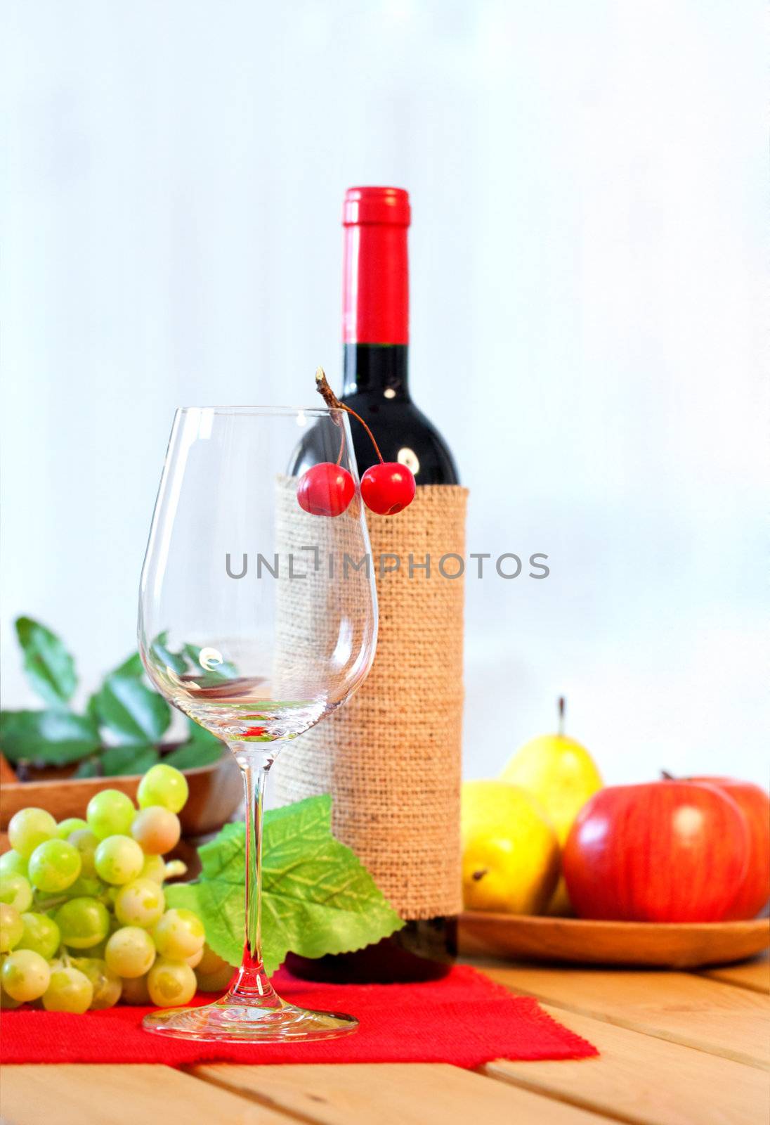 red wine with two glass on wooden table