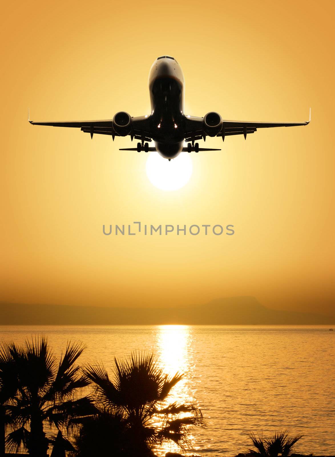 beautiful sea view and plane on sunset background