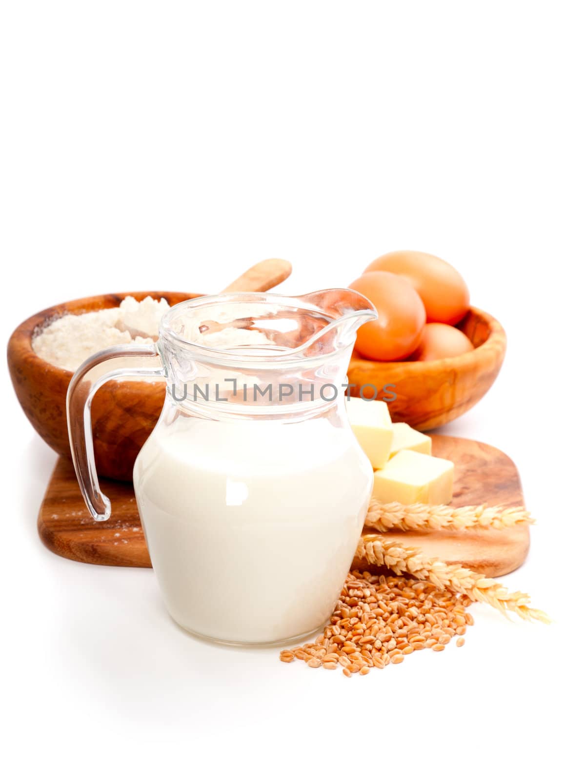 Milk Pitcher isolated with ingredients for baking, isolated on a white background