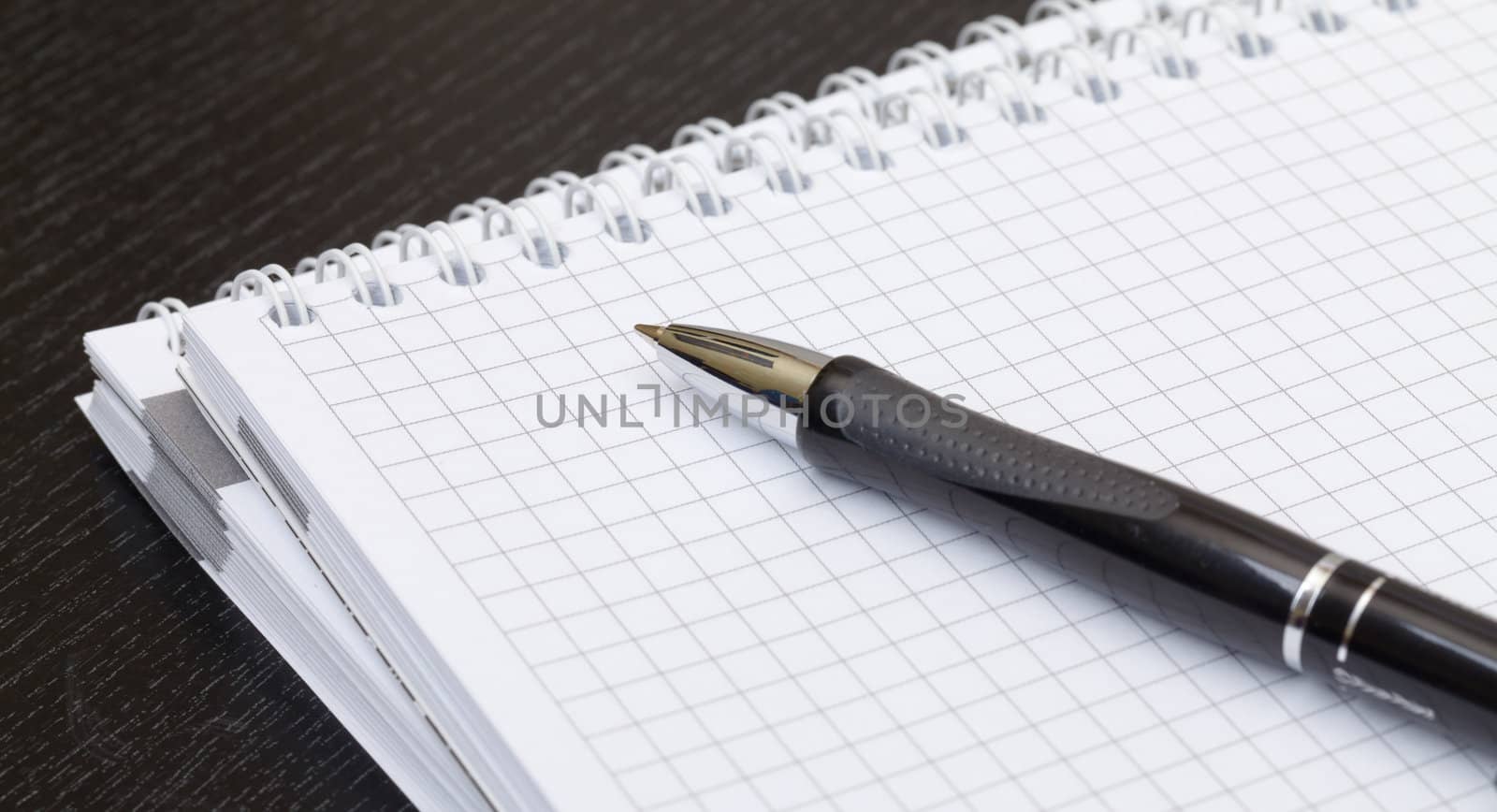 black pen and notebook, closeup