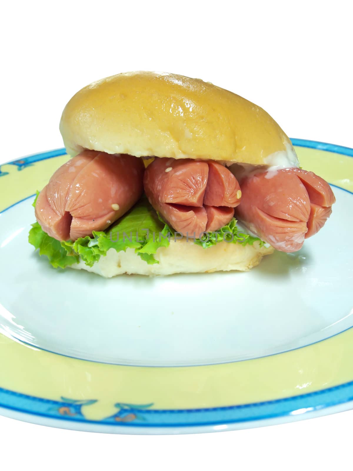 Hot dog in hamburger bread on dish isolate on white