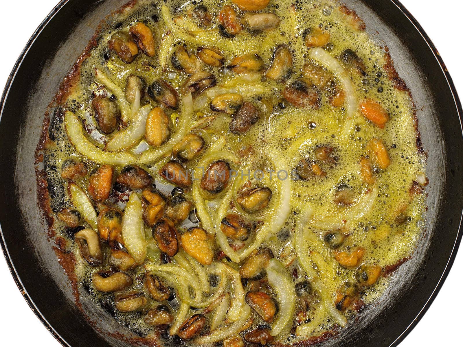 Mussels with onion being cooked in frying pan.