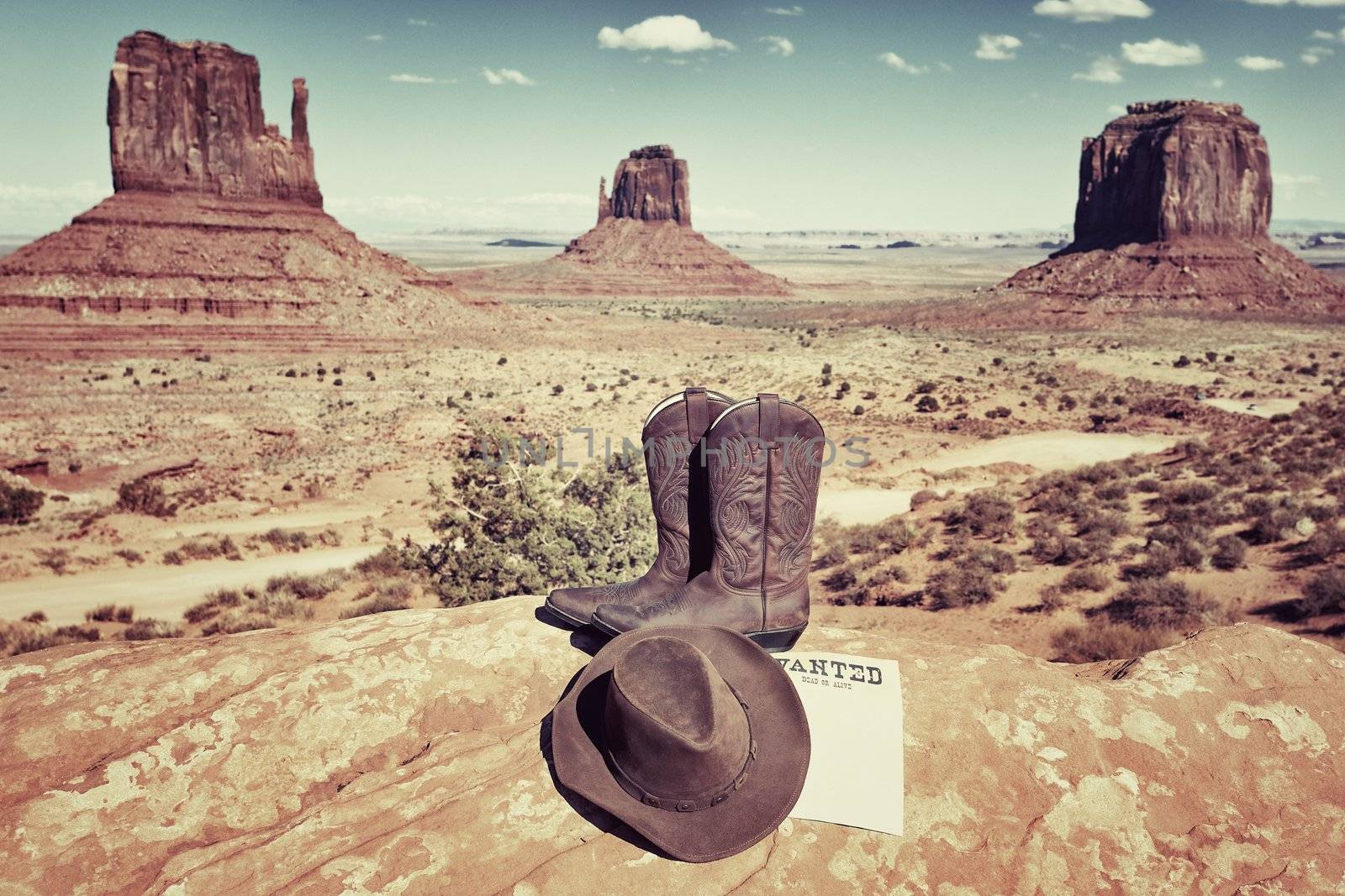 boots and hat in front of famous Monument Valley, USA