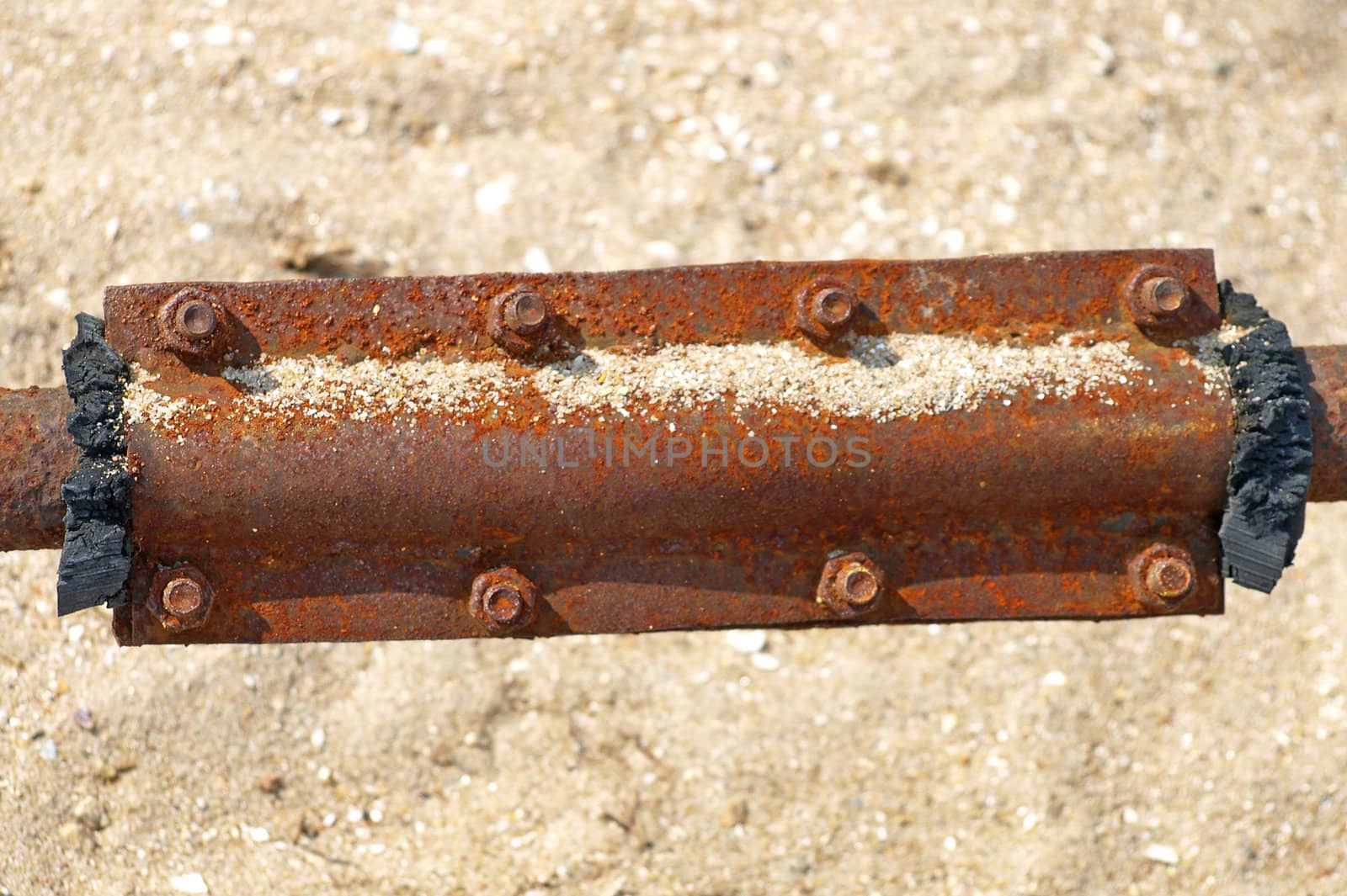 Rusty metal patch on a water pipe.