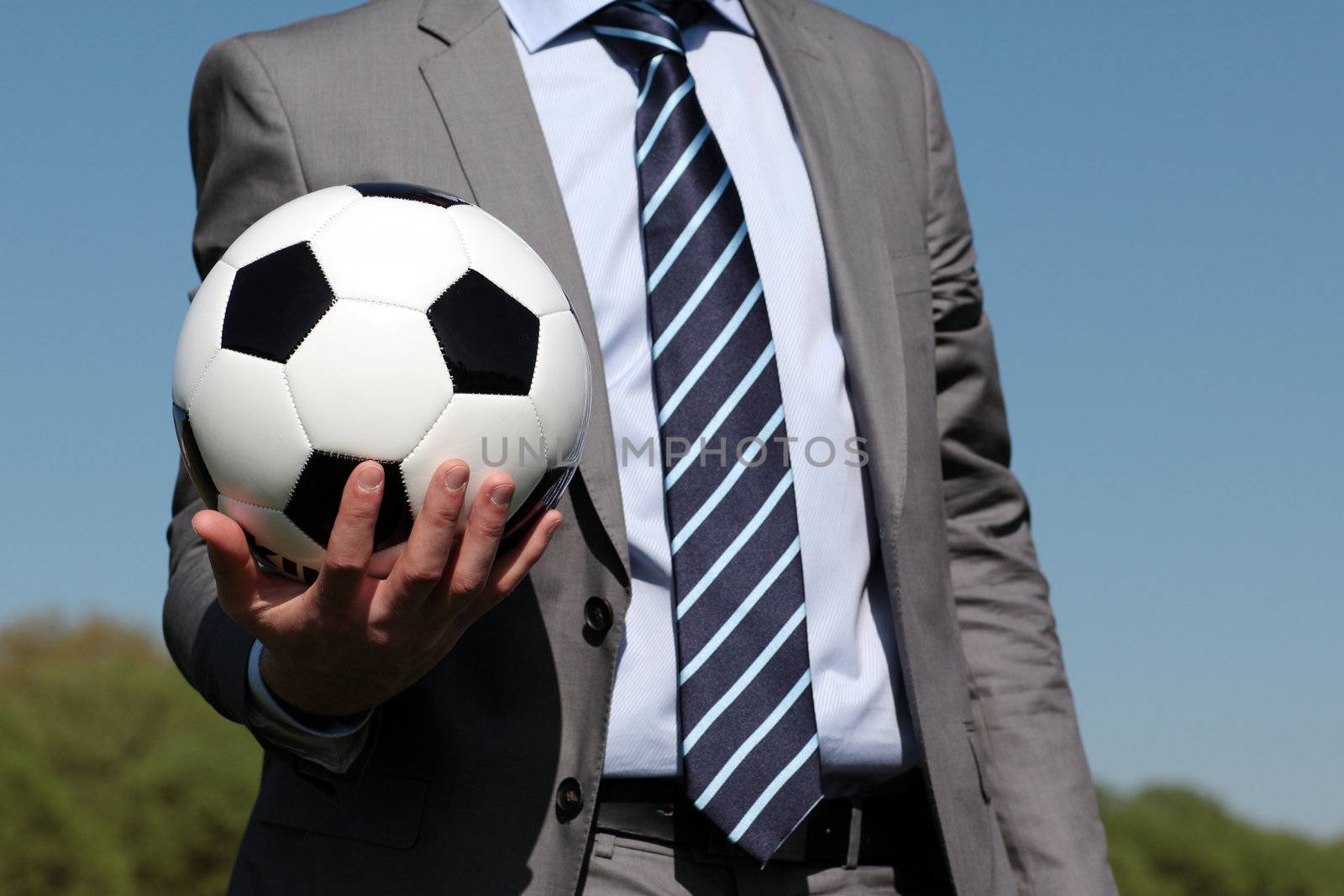 ball in the hand of a coach