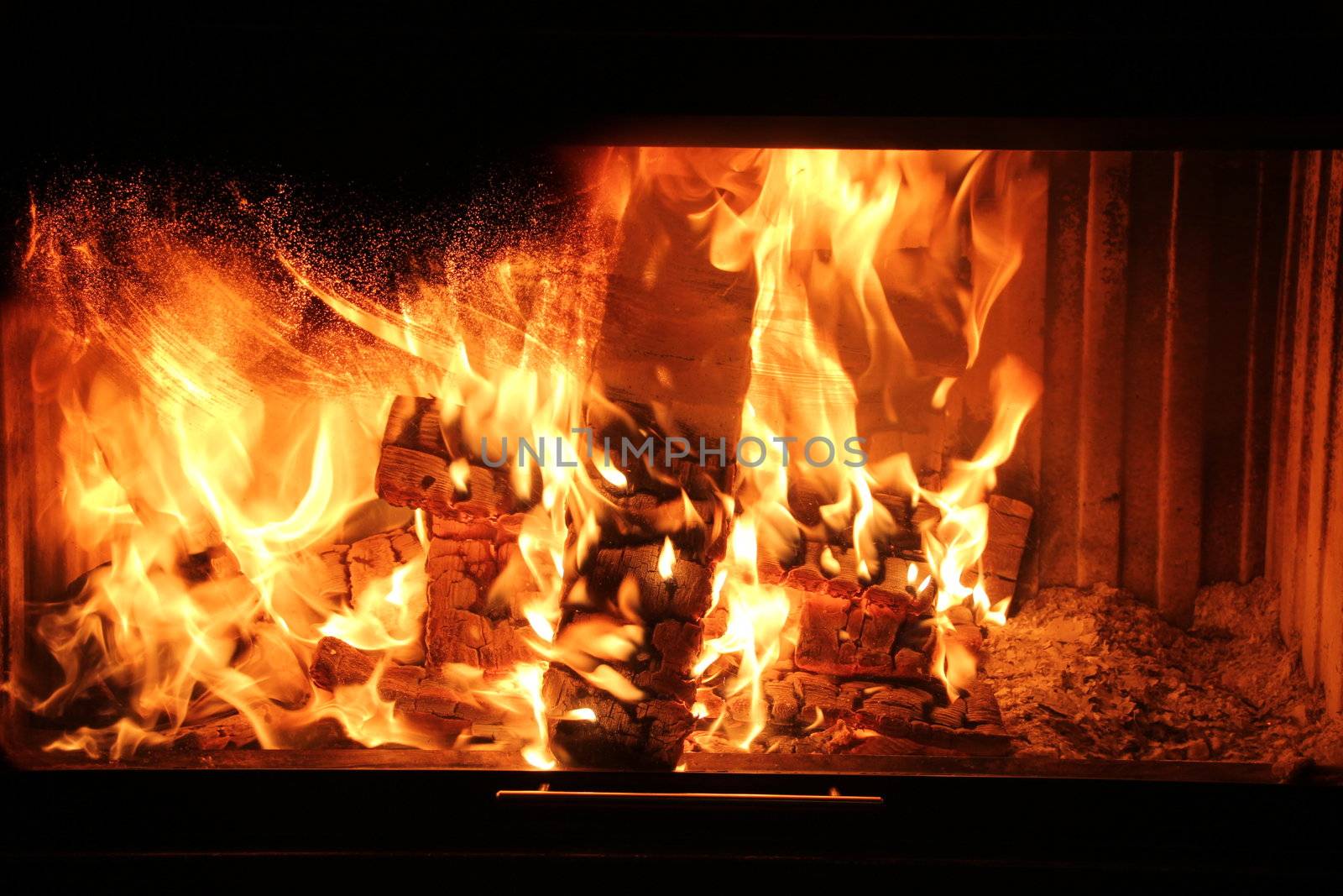 Beautiful wood burning in the fireplace red coals