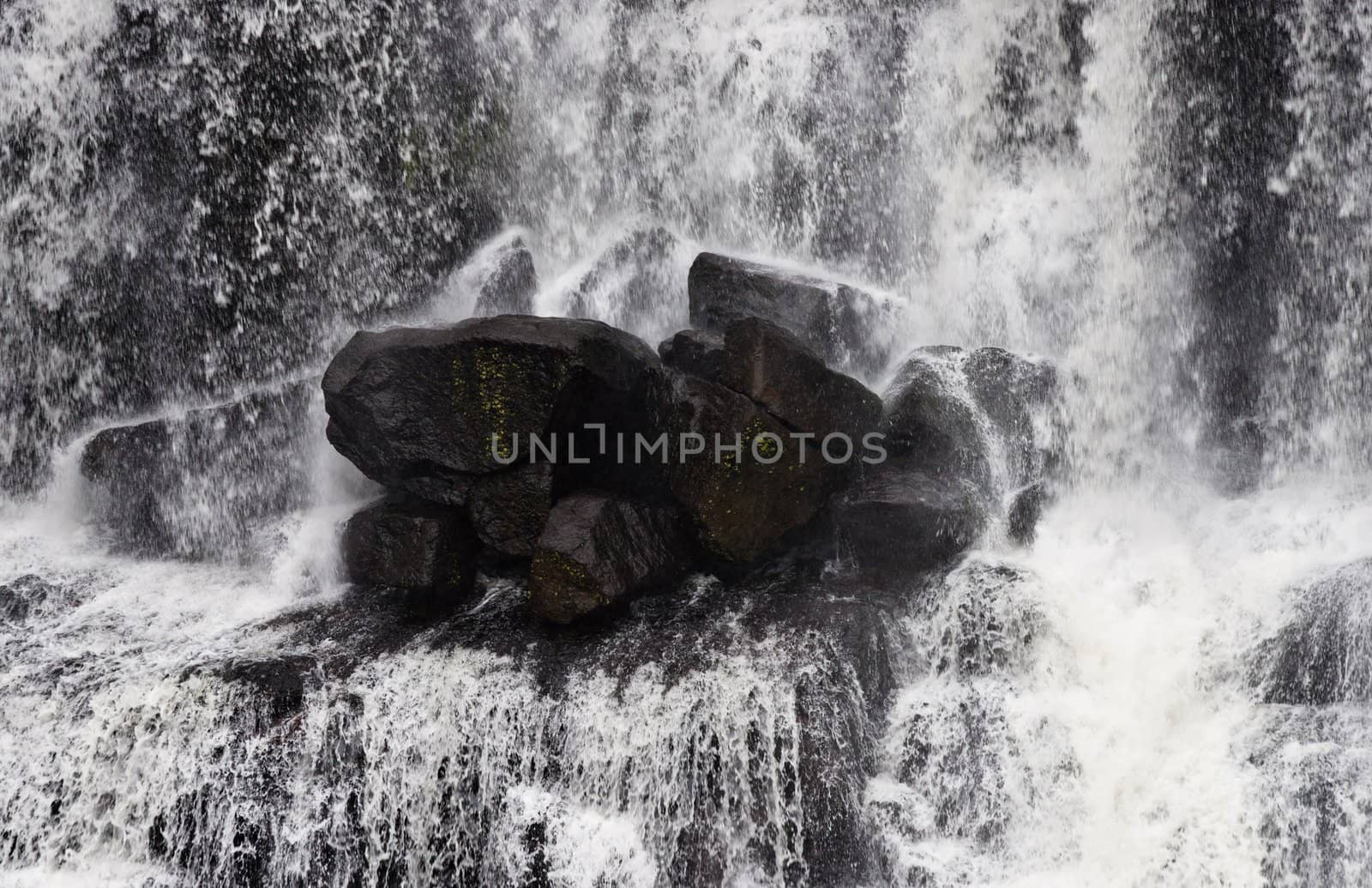 rocks in waterfall by clearviewstock
