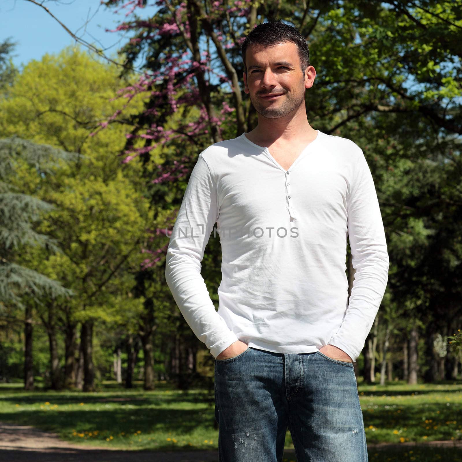 handsome man in a park in spring