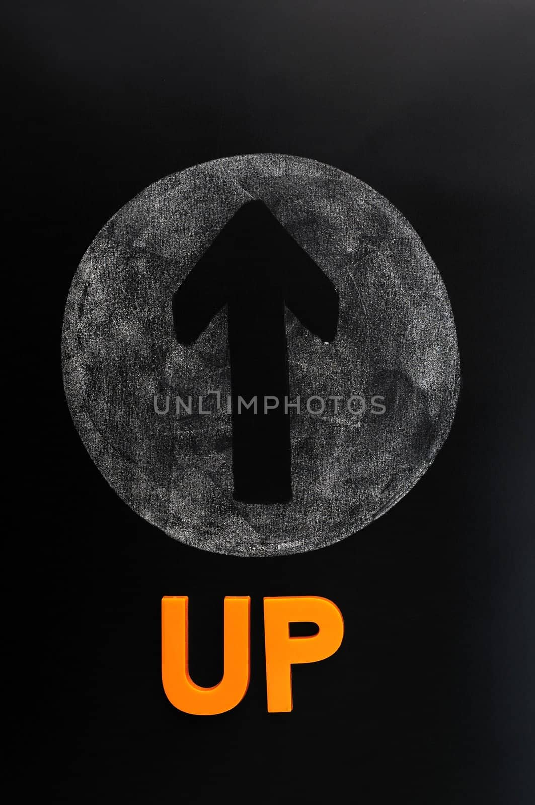 Arrow of up drawn on a blackboard