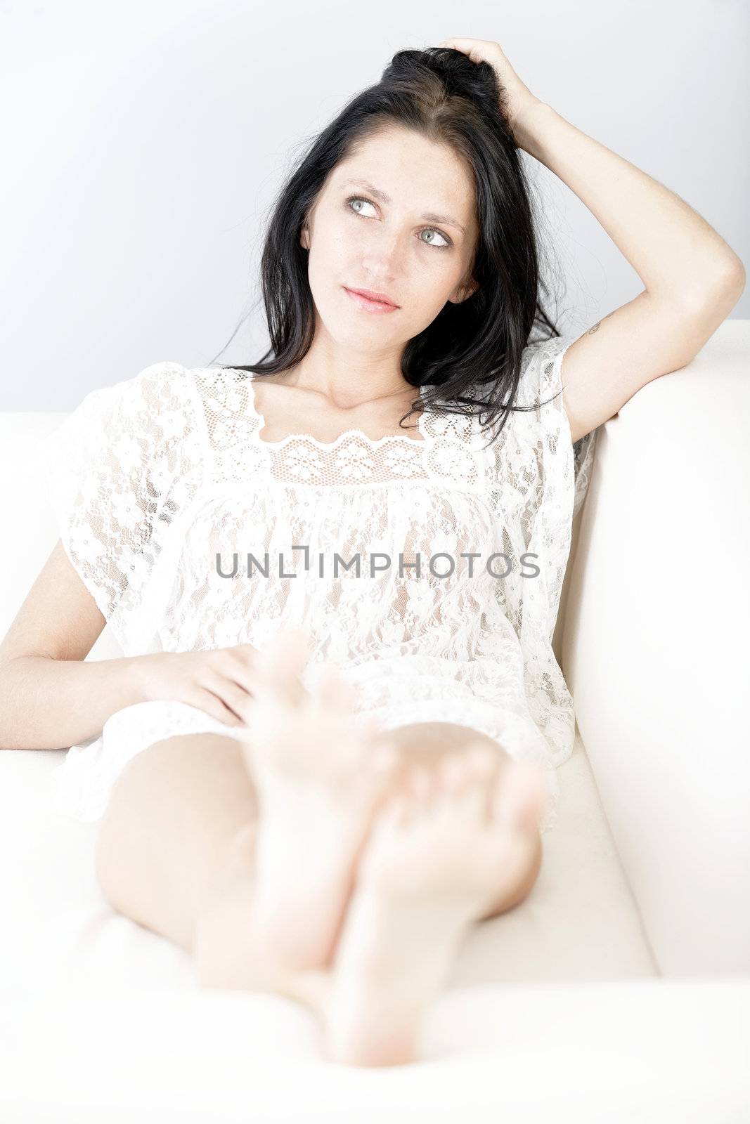 Woman with her feet up by studiofi