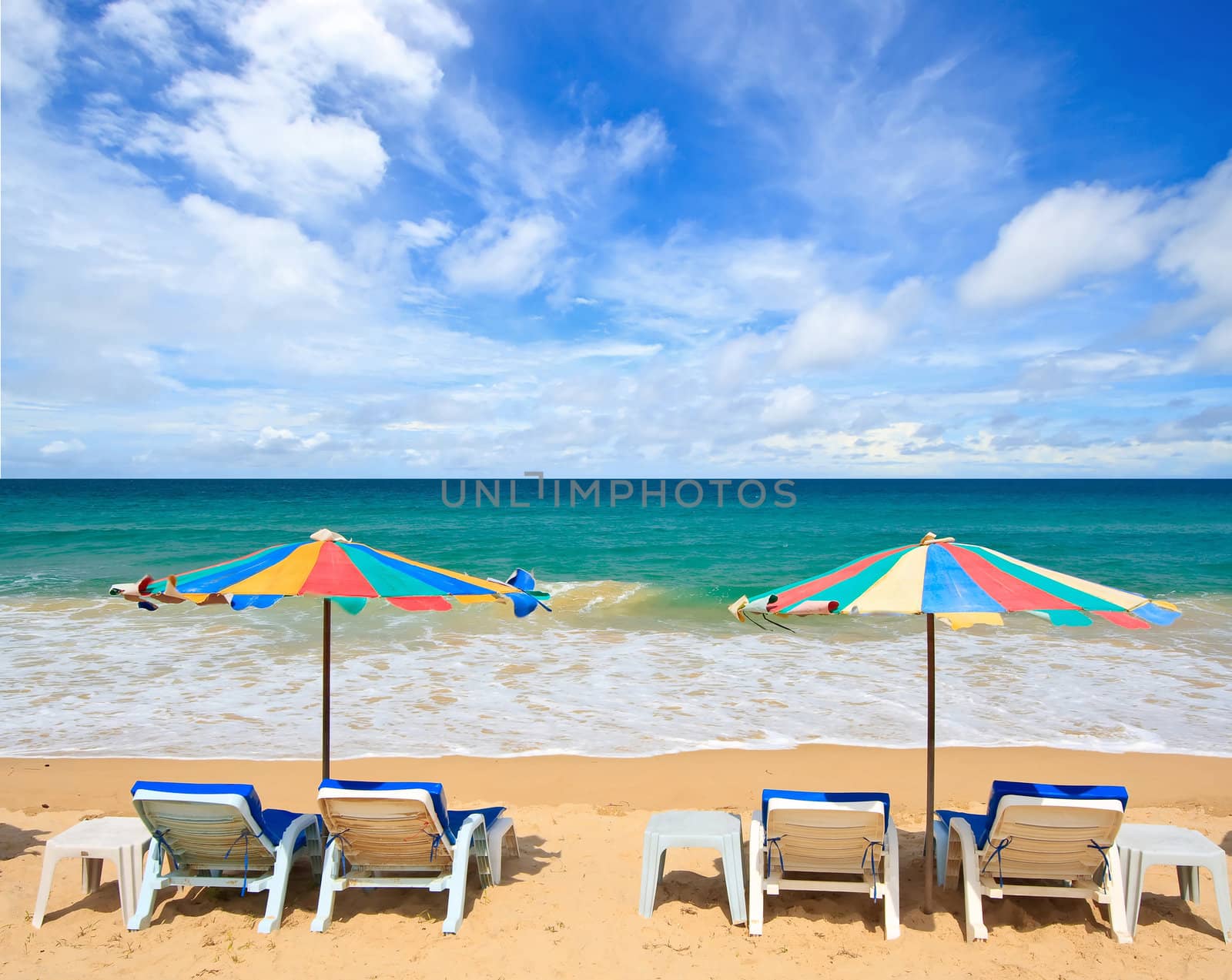 Colorful Umbrella and chair on the beach