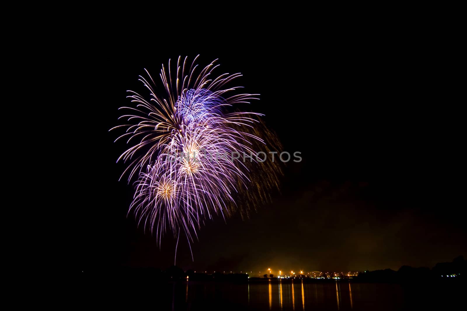 Fireworks and reflection at lake on King Birthday Festival and Holiday in Thailand.