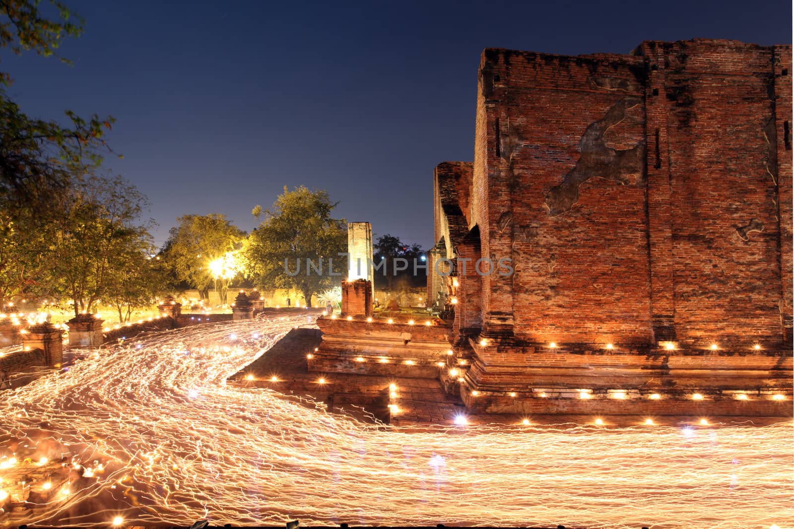 candle light trail of Buddhism Ceremony at temple ruin on Asalha Puja day