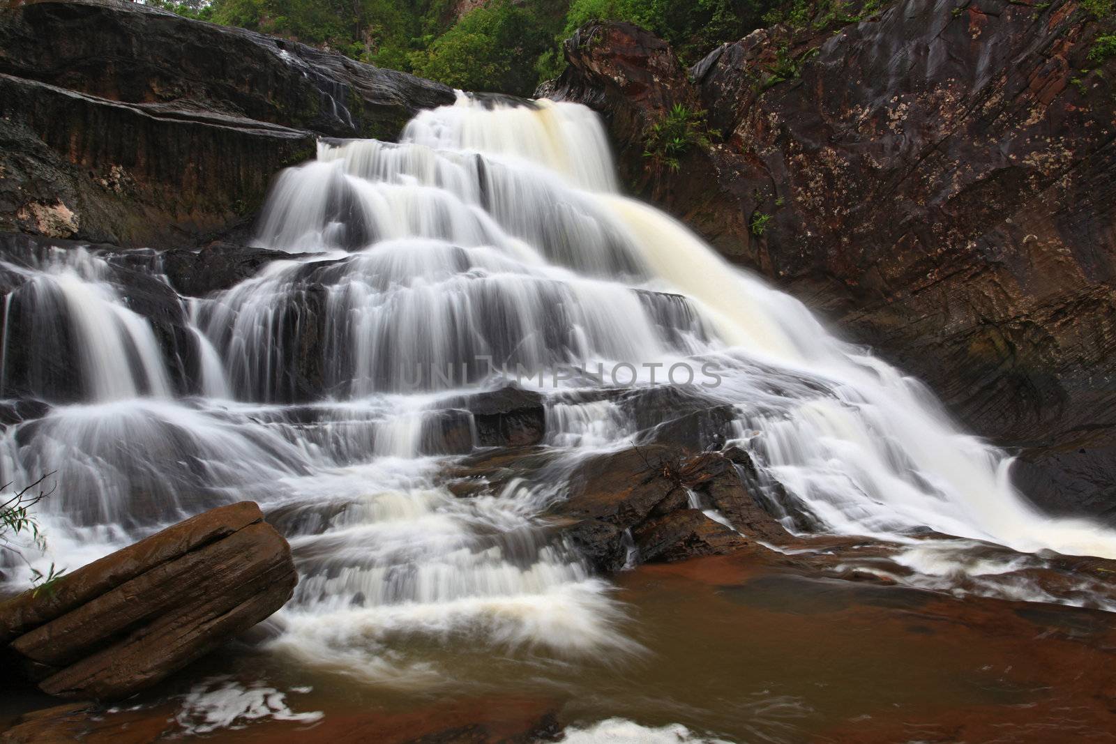 tropical rainforest waterfall in jungle of Thailand