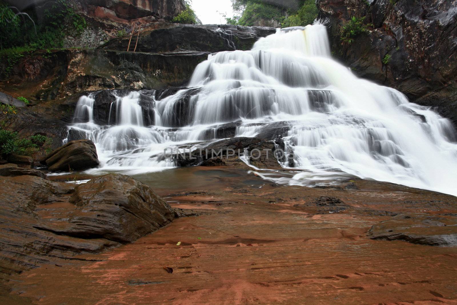 tropical rainforest waterfall in jungle of Thailand landscpae