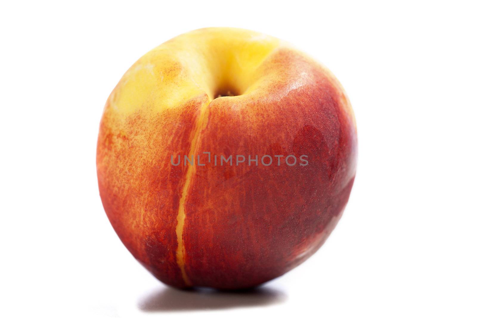 Fresh ripe nectarine on an isolated background