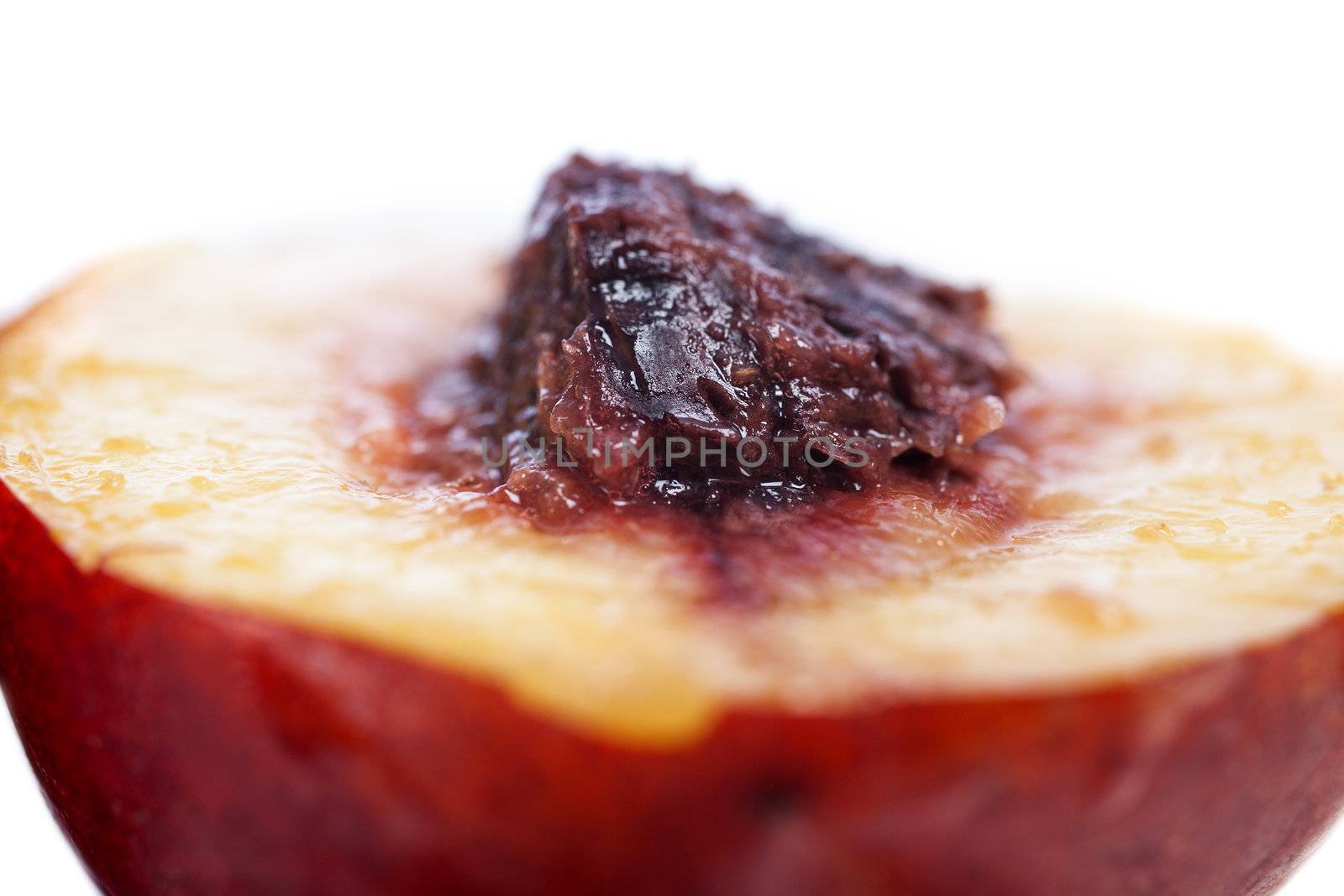 Fresh Nectarine sliced in two exposing the seed