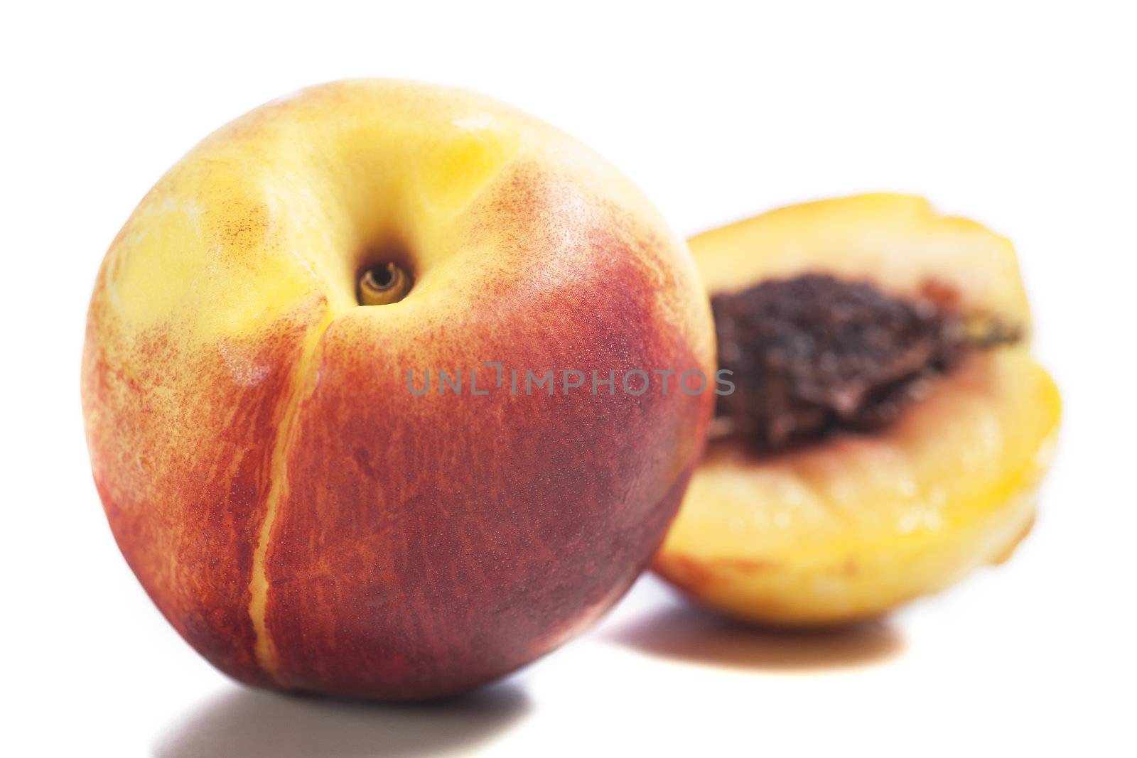 Whole and sliced fresh ripe Nectarines on an isolated background