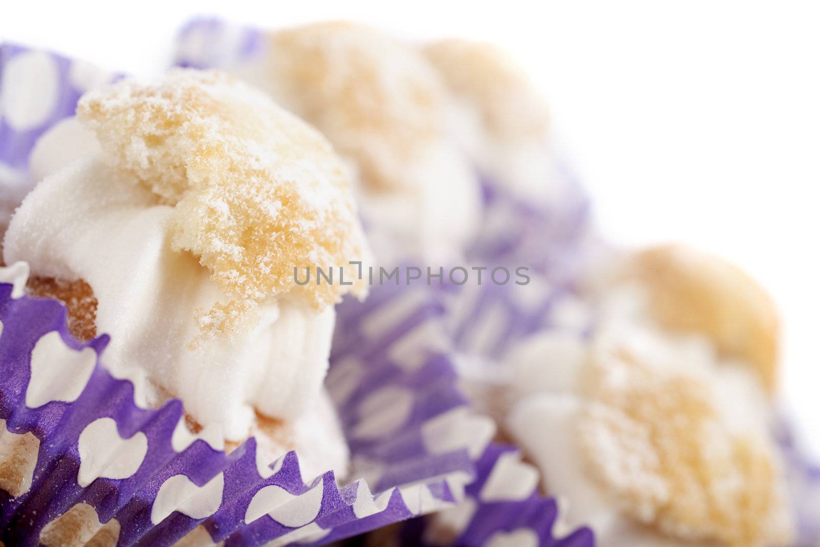 Freshly baked cup cakes with cream filling in cake trays