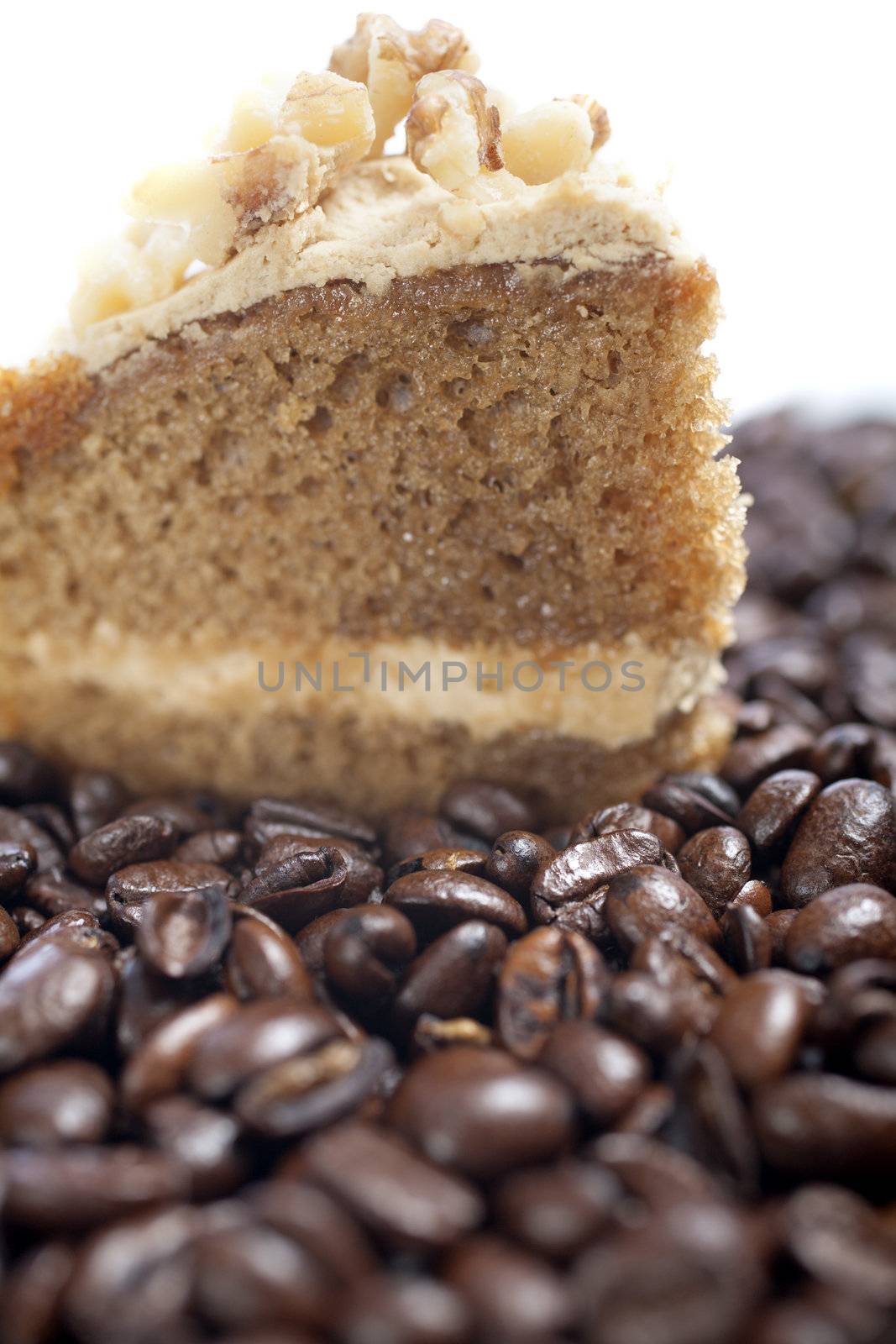Fresh coffee cake surrounded by dried coffee beans