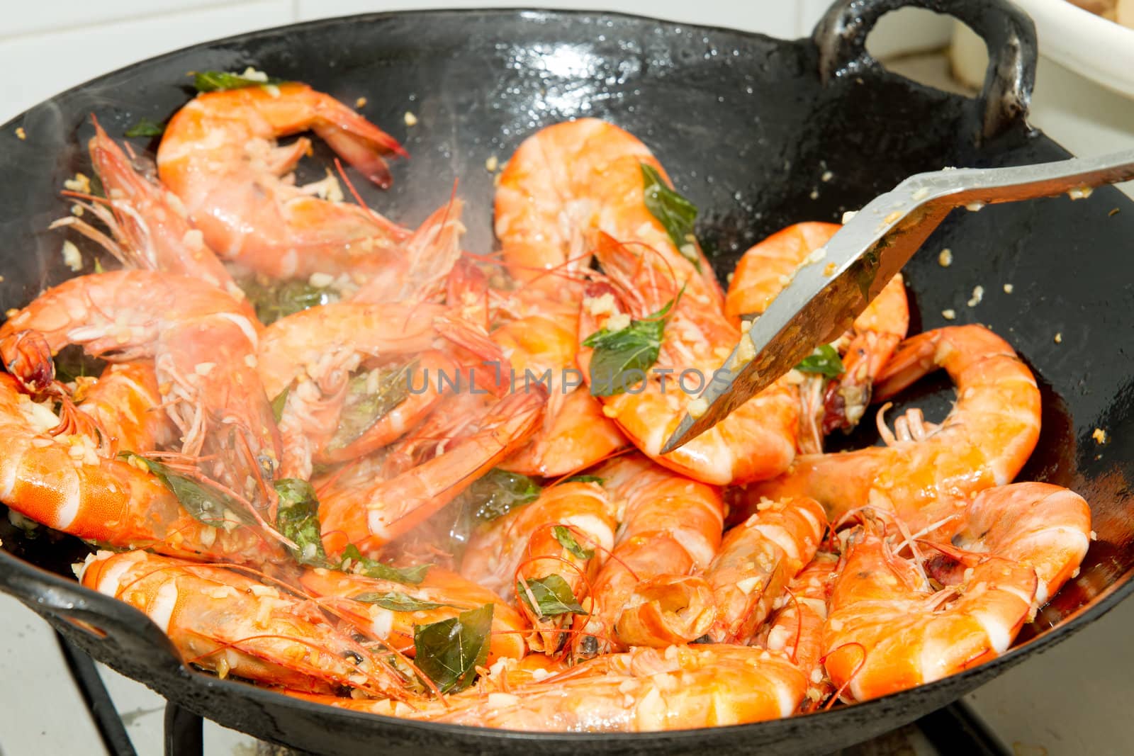 Stir Fry Prawns with Curry Leaves and Garlic in Wok