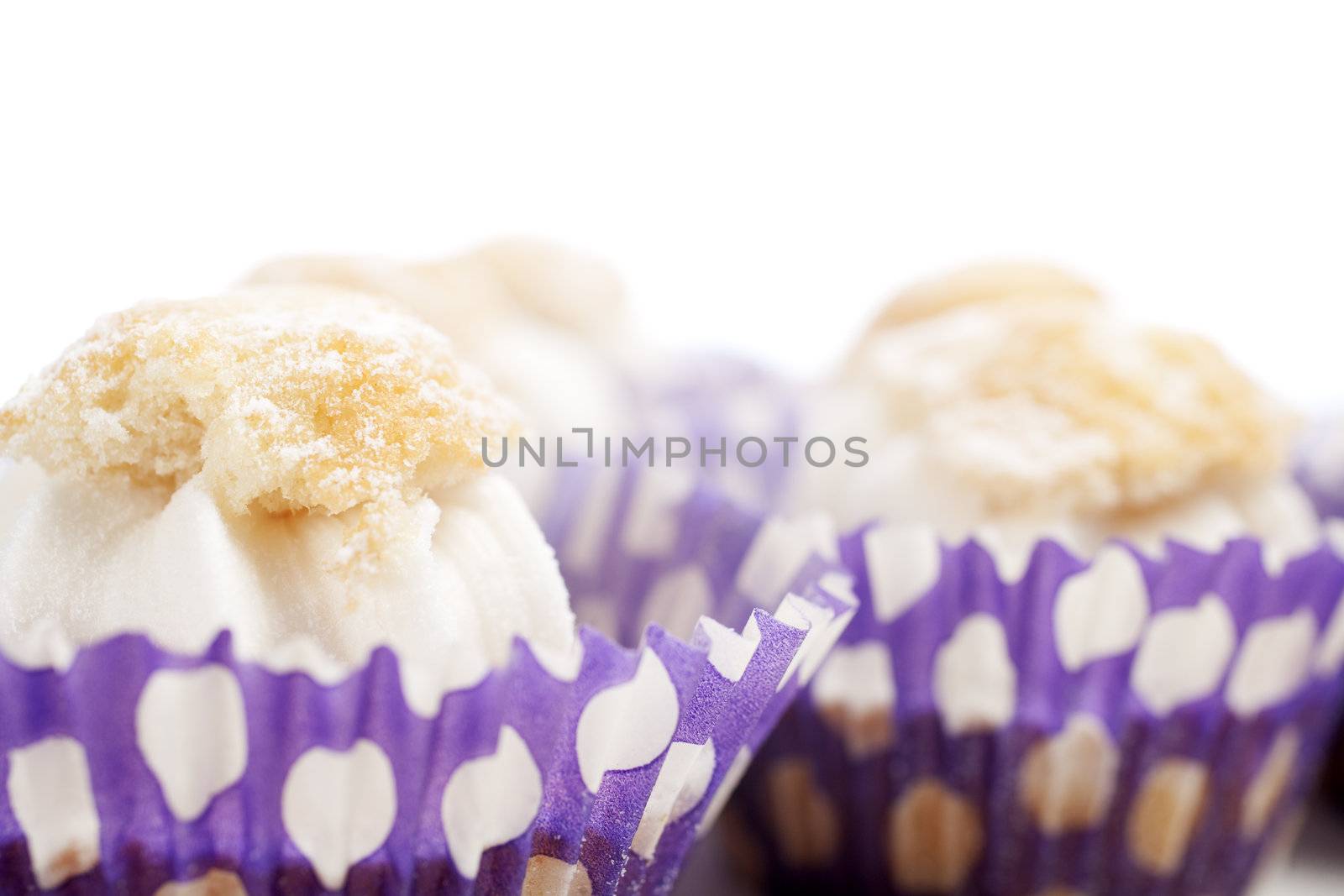 Freshly baked cup cakes with cream filling in cake trays