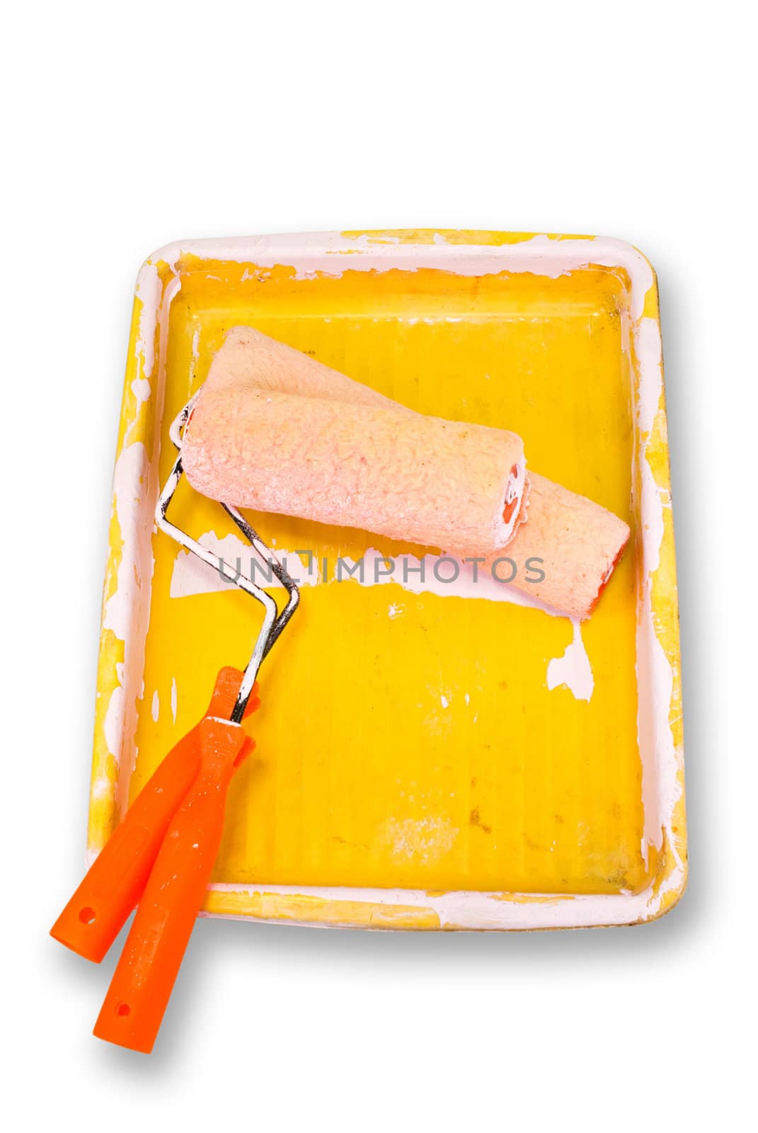 Used paint roller with tray on white background