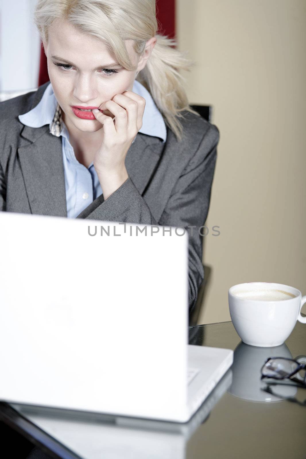 Attractive woman working on her laptop catching up after a long day.