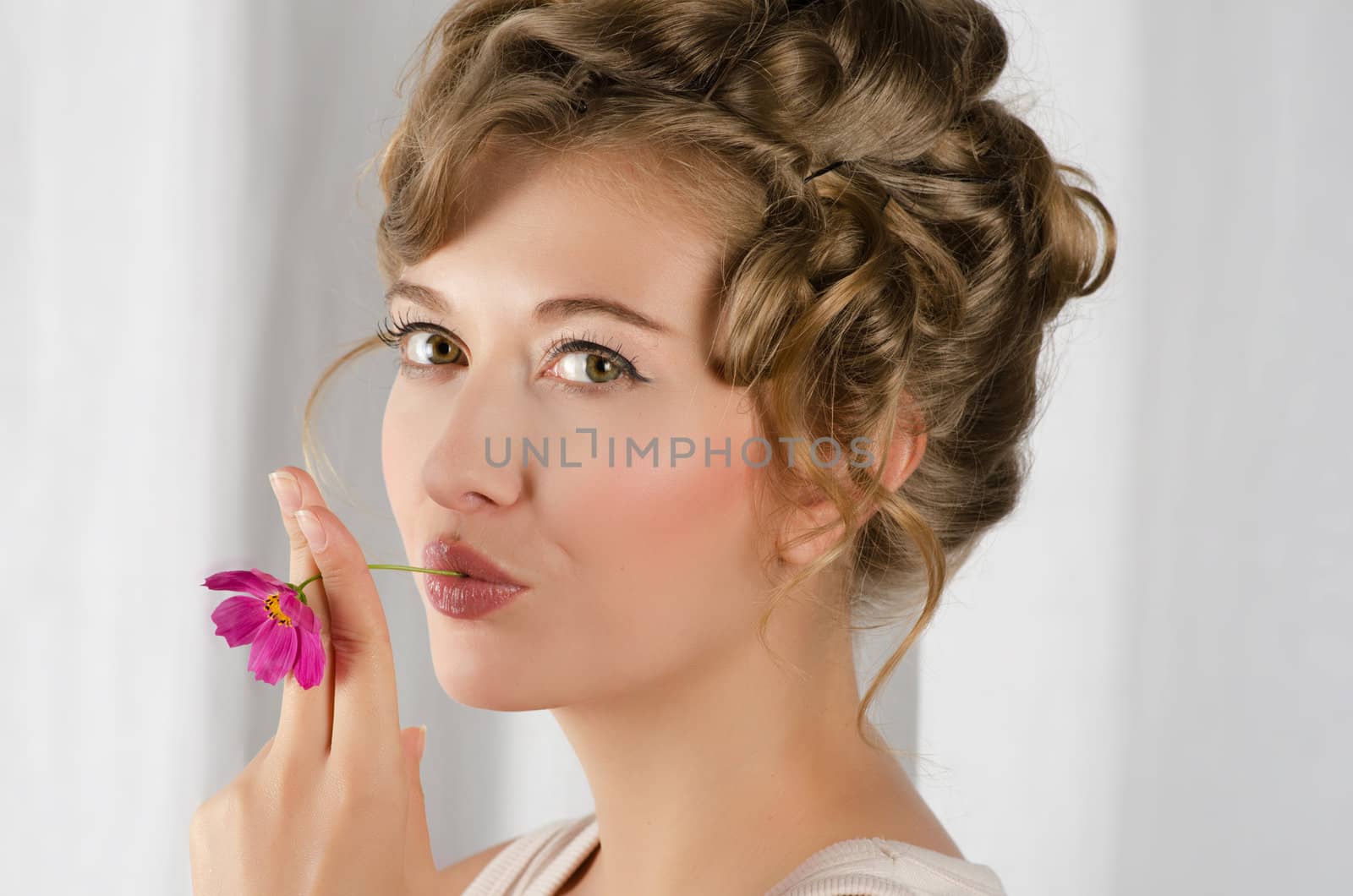 beauty woman closeup portrait with flower over grey background