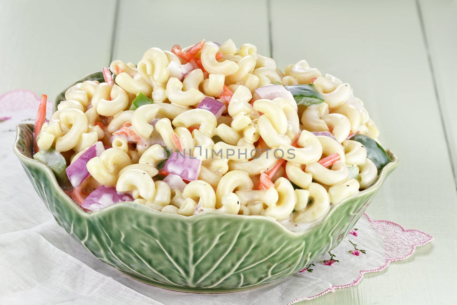 Macaroni salad with mayonaise and vegetables. 
