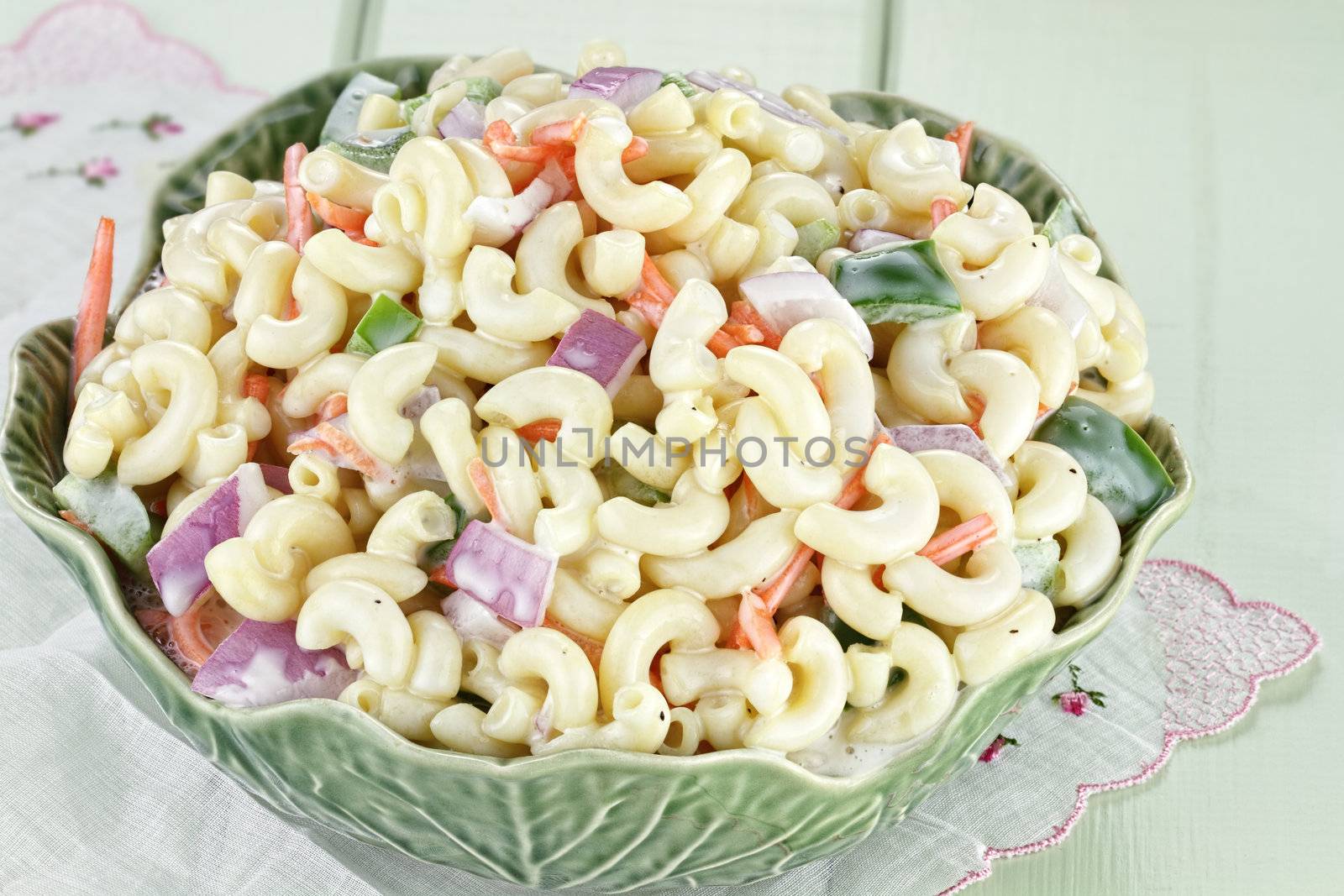 Macaroni salad with mayonaise and vegetables. 
