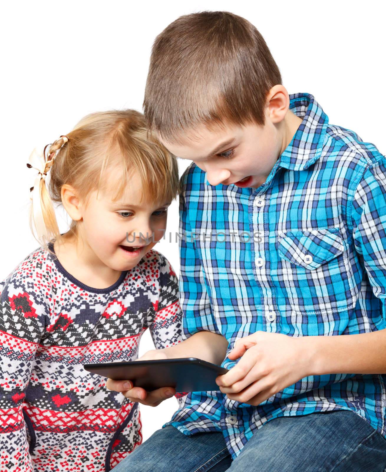 Children playing with a tablet computer by naumoid