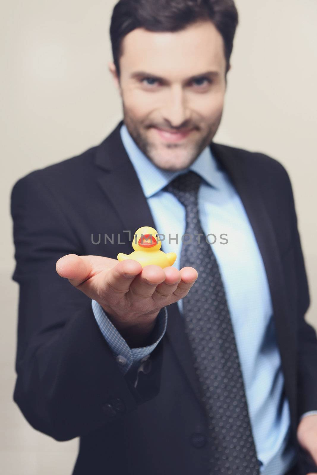 A young man with a yellow rubber duck