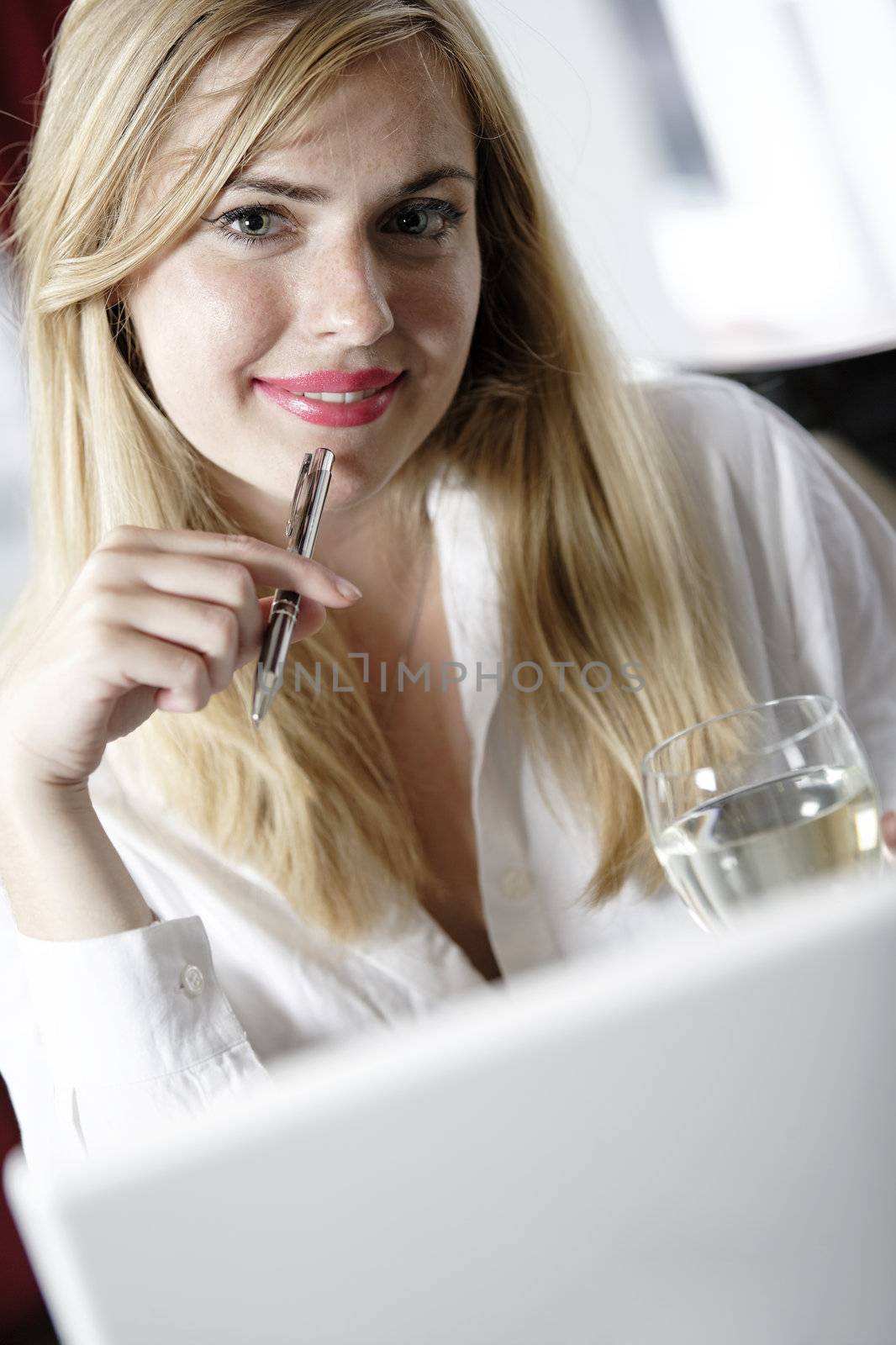 Attractive woman working on her laptop catching up after a long day.