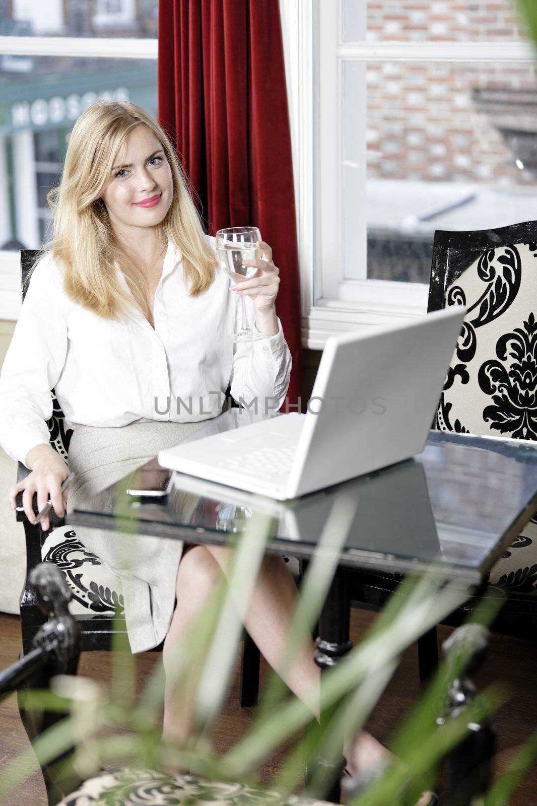 Attractive woman working on her laptop catching up after a long day.