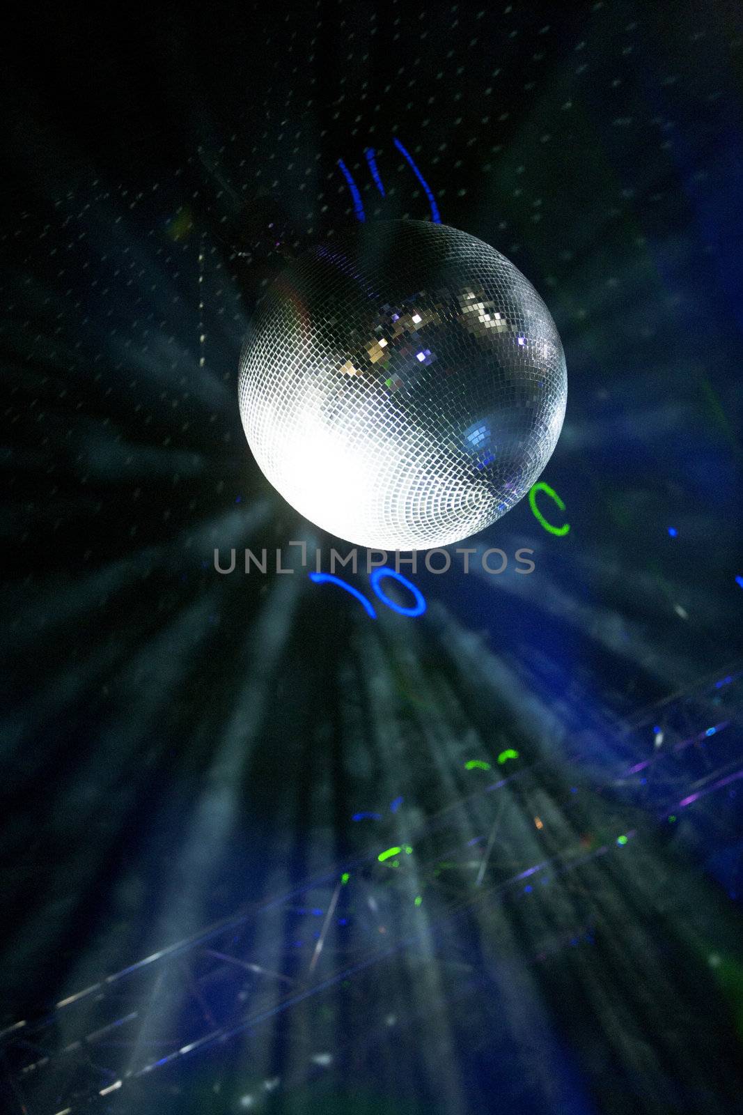 Glitter ball on dance floor by studiofi
