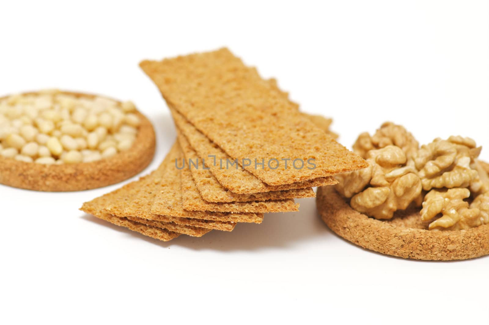 Wholegrains Crispbread with peanut and pine nut isolated on white background