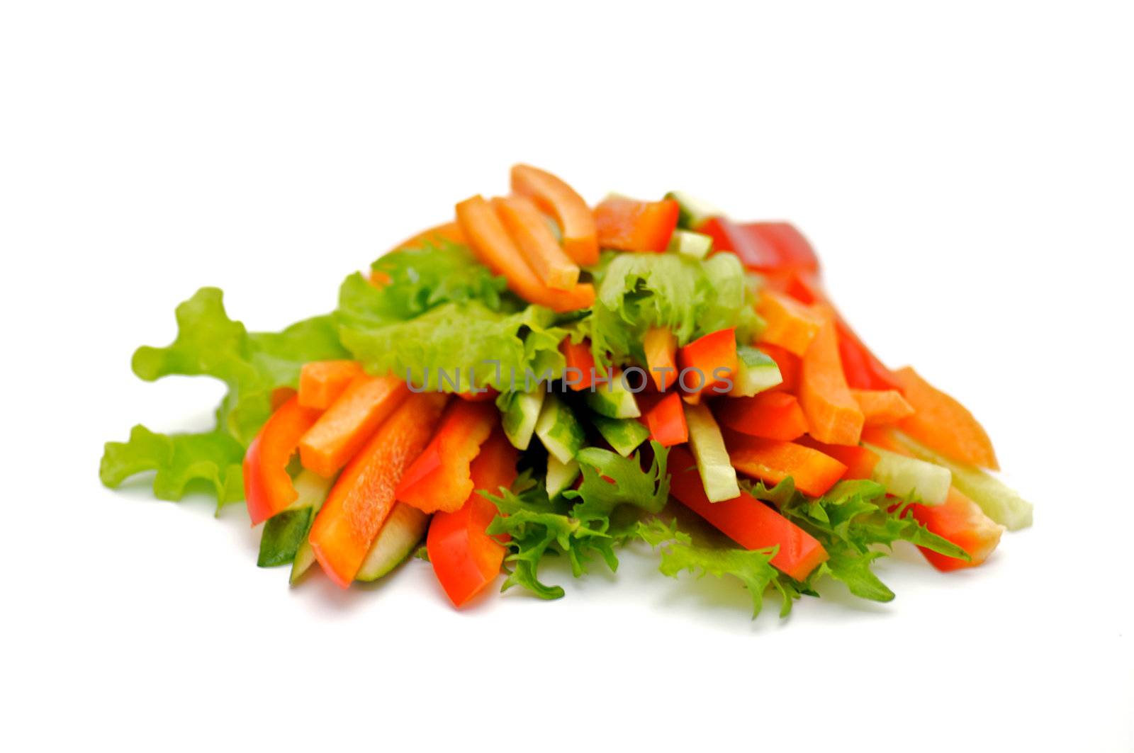 Red Bell pepper, cucumber and carrots straws with salad leaves isolated on white background