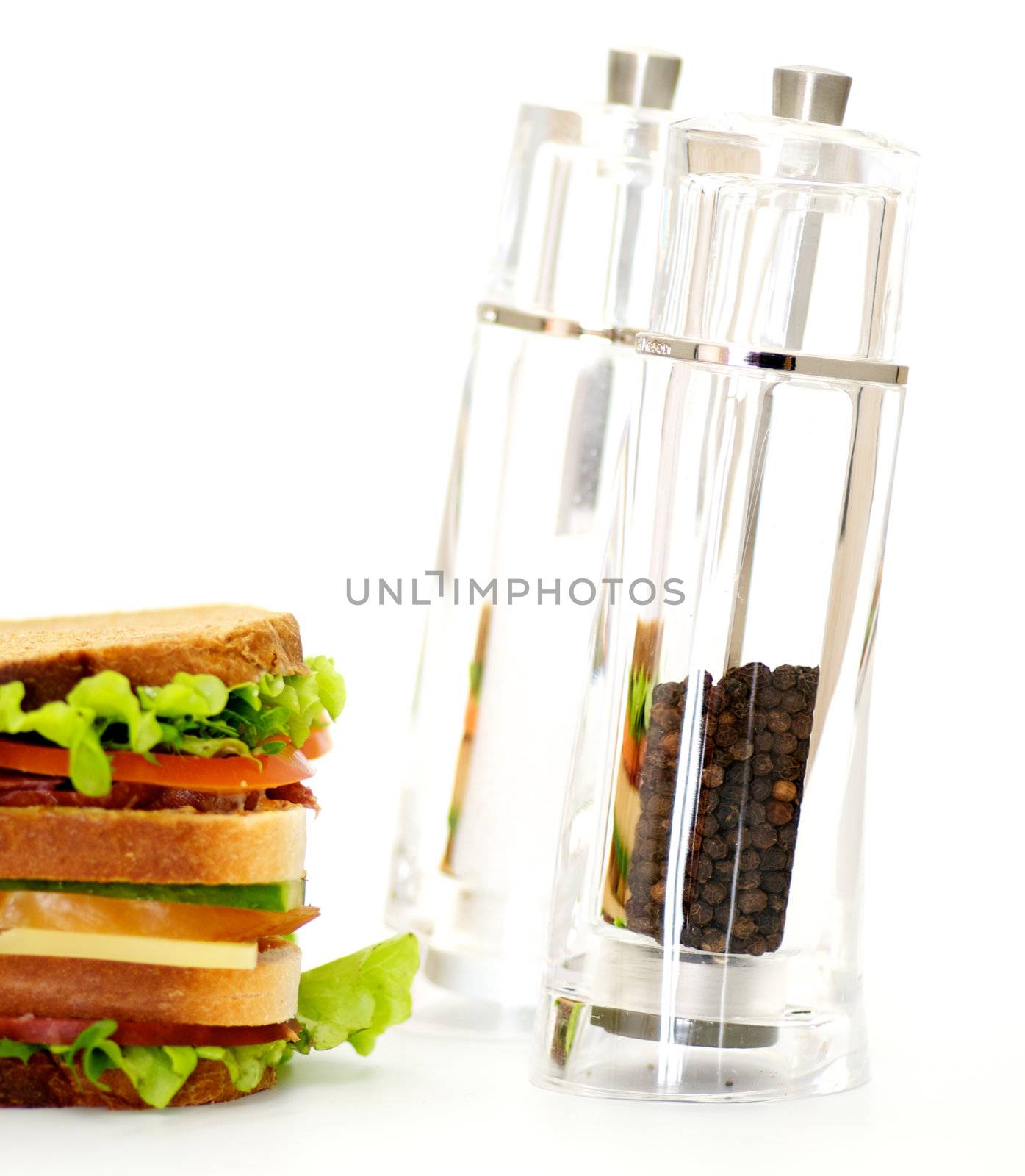 Classical BLT Club Sandwich with Saltcellar and pepperbox isolated on white background