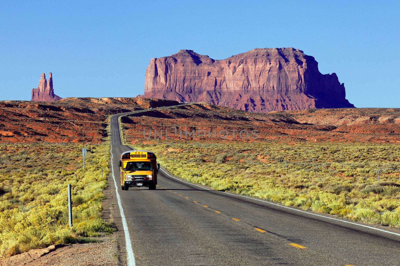 school bus on the road at Monument Valley, USA