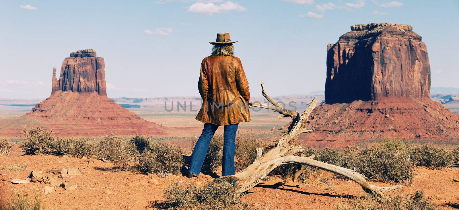 panoramic view of cowgirl at Monument Valley, Utah, USA