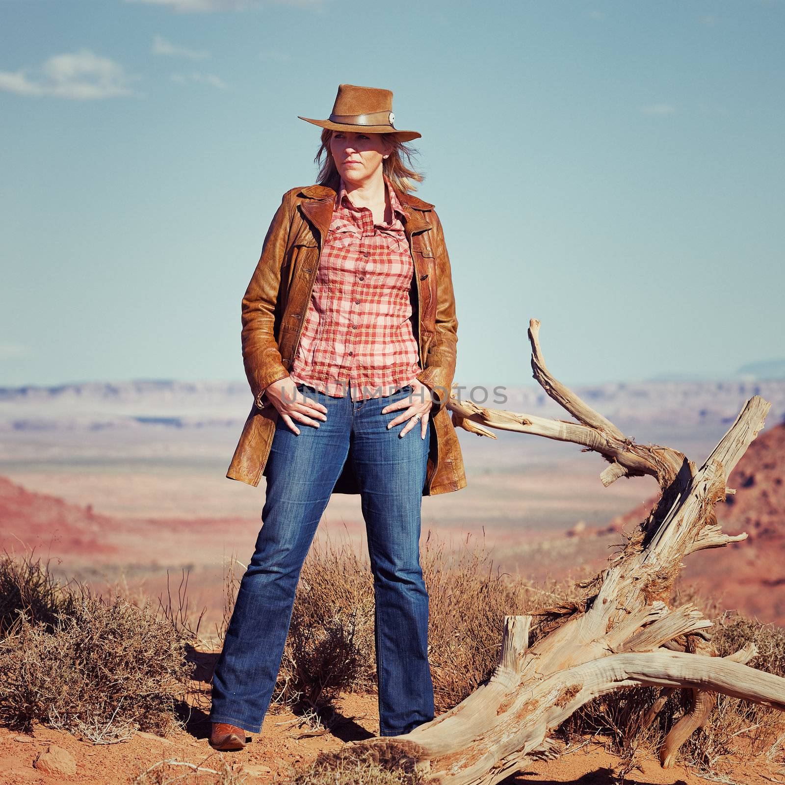 blond cowgirl in the desert, Utah, USA