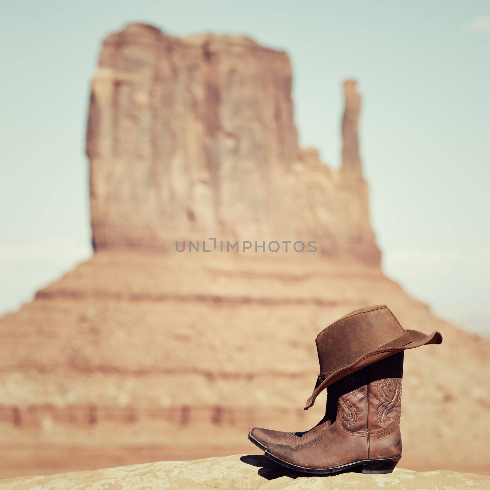vintage boots and hat in Monument Valley