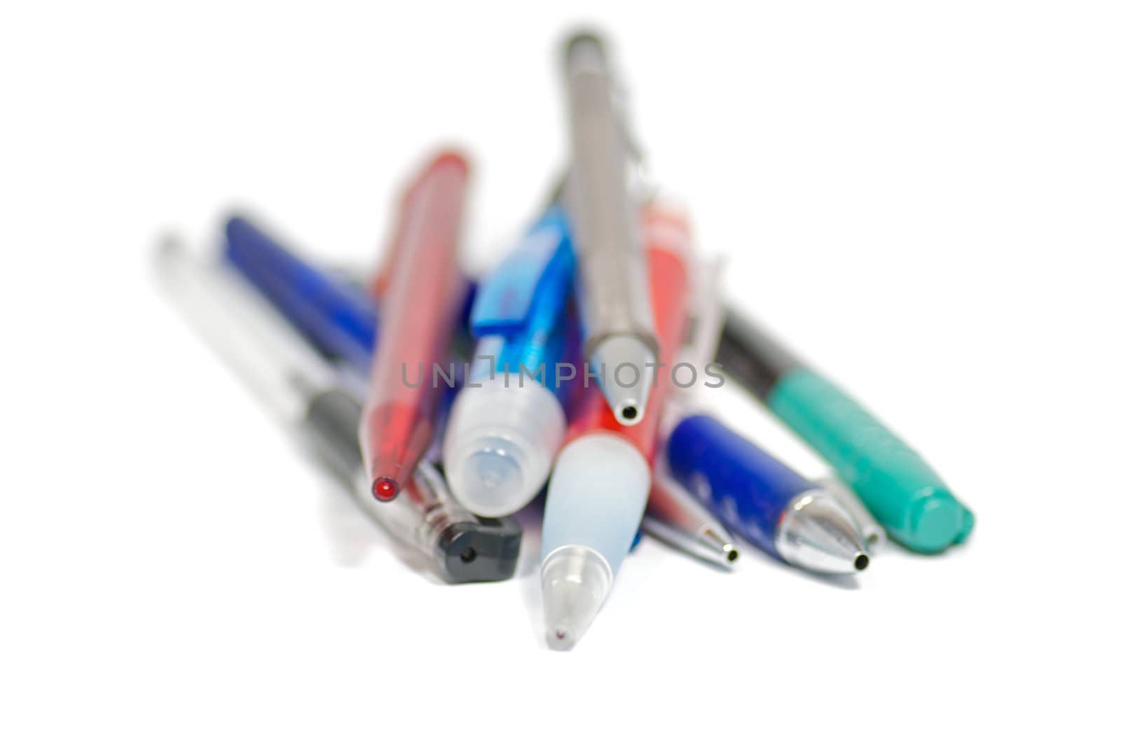 Pens, markers and pencils isolated on white background