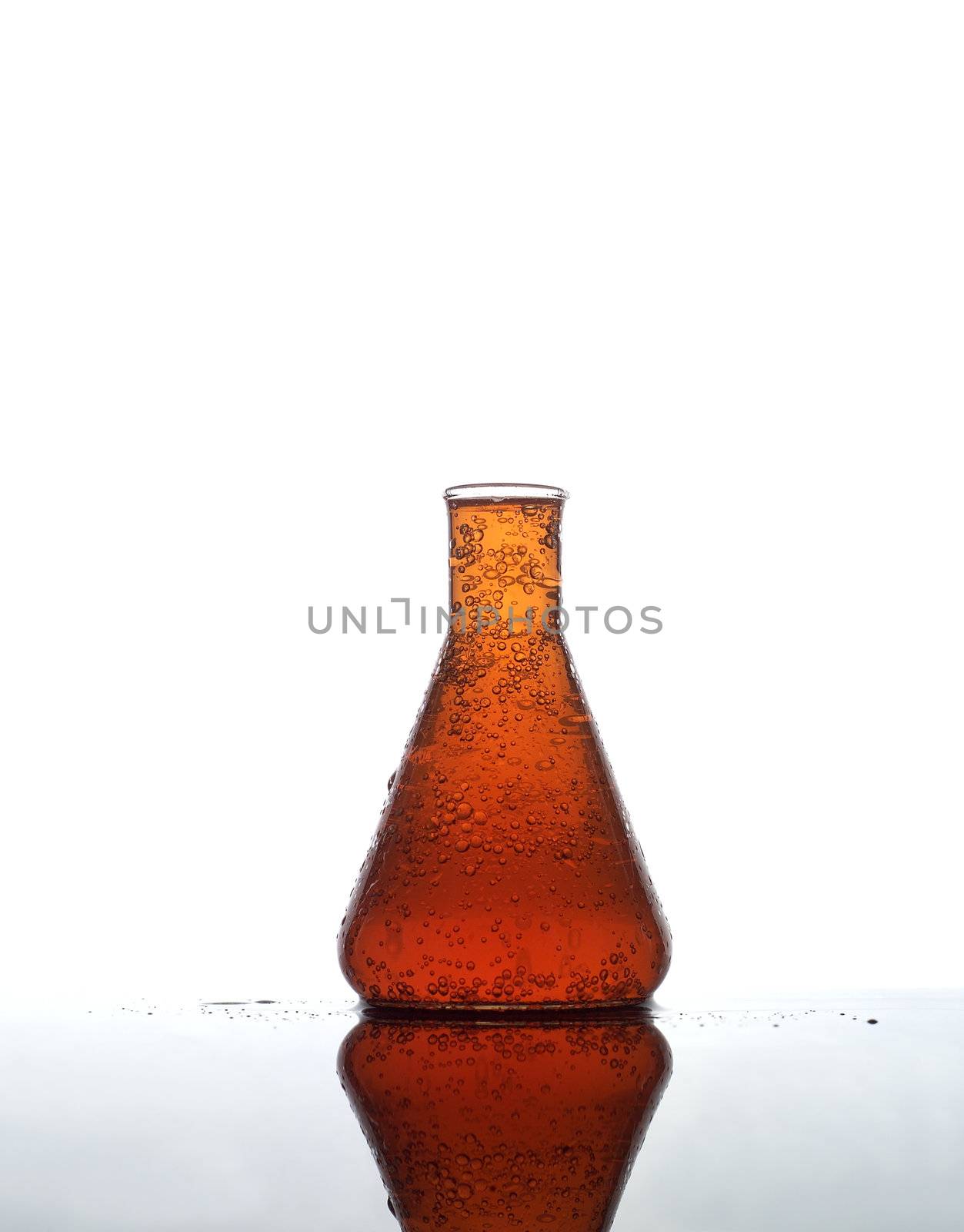 Laboratory Glass with orange liquid