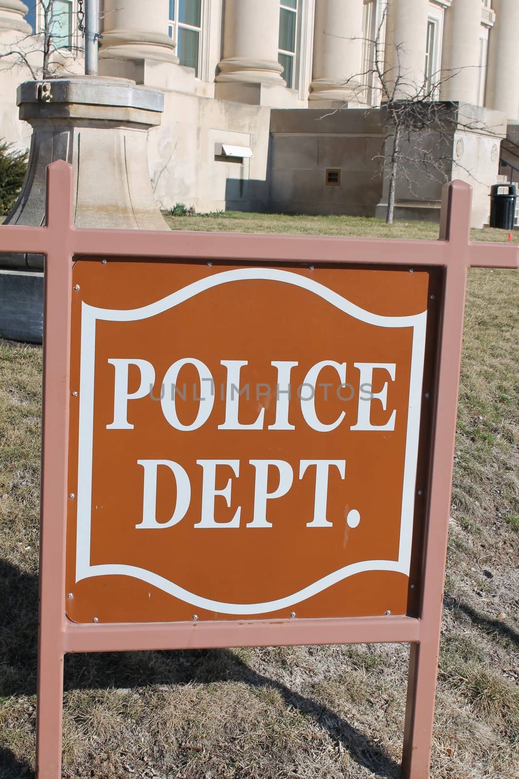 Police department sign located outside of a police station.