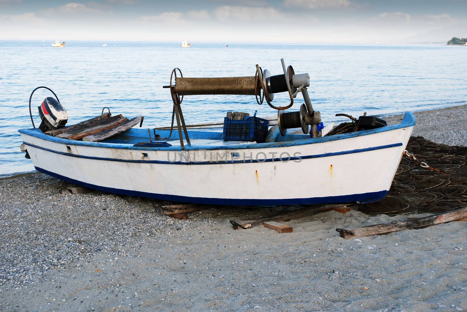 twilight with old fishing boat on beach