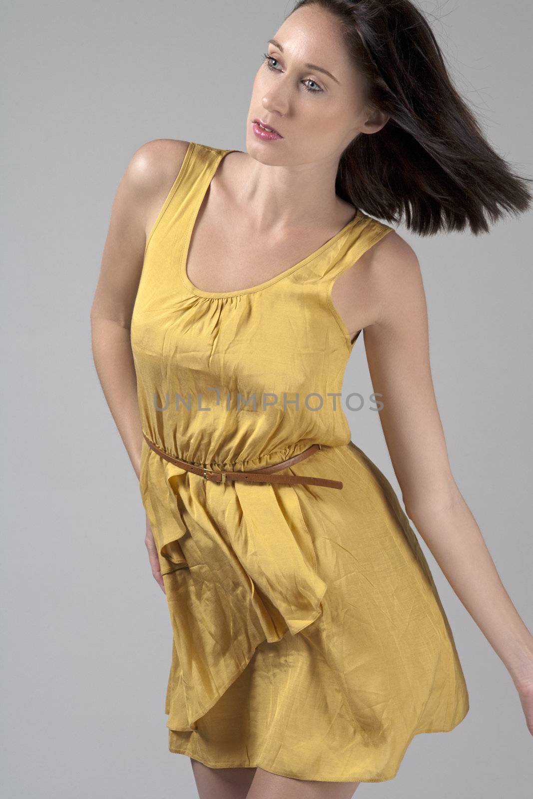 Woman wearing a flowing yellow dress